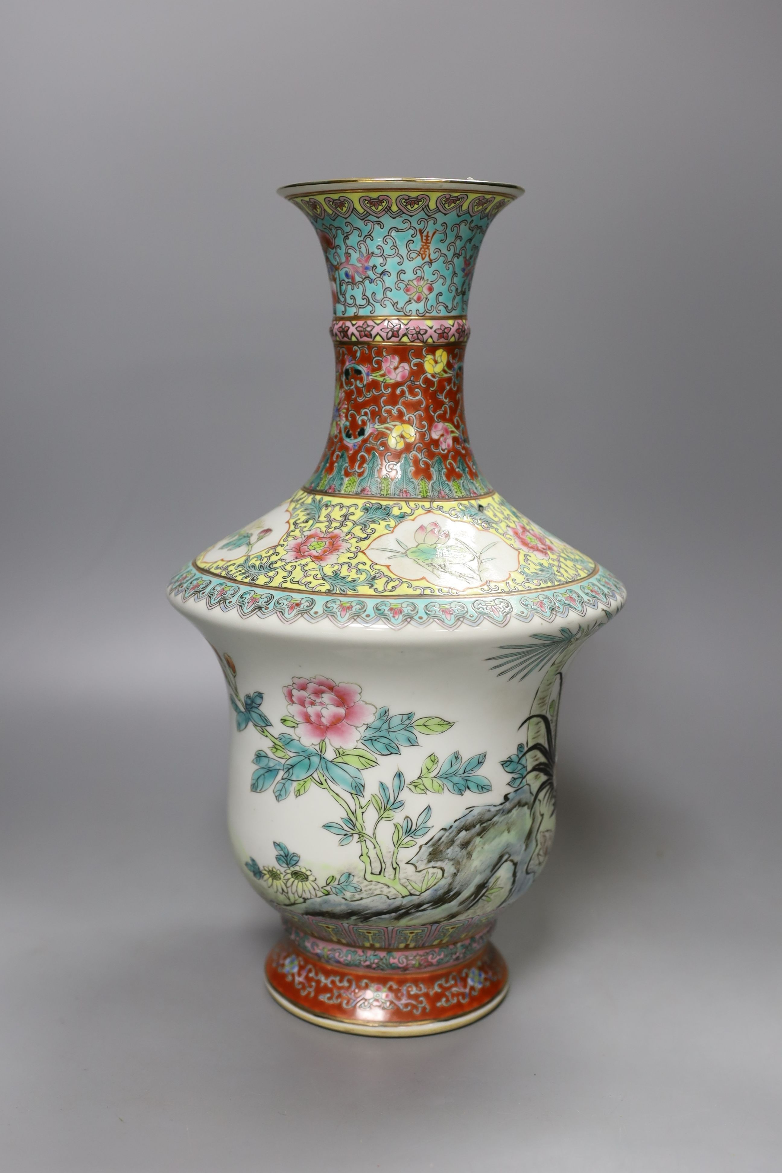 A Chinese famille rose vase, 20th century with drilled base mark - 33cm tall